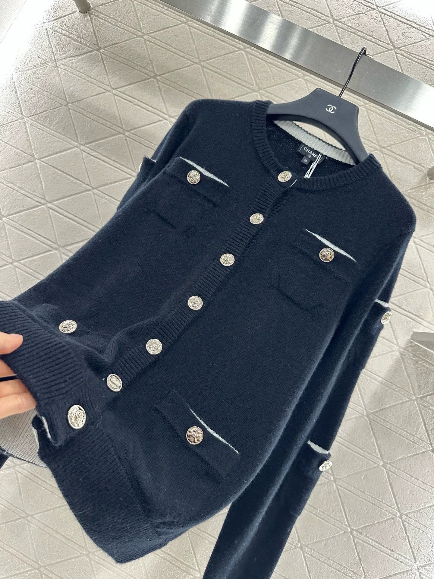 C 25 Multi-button knitted cardigan