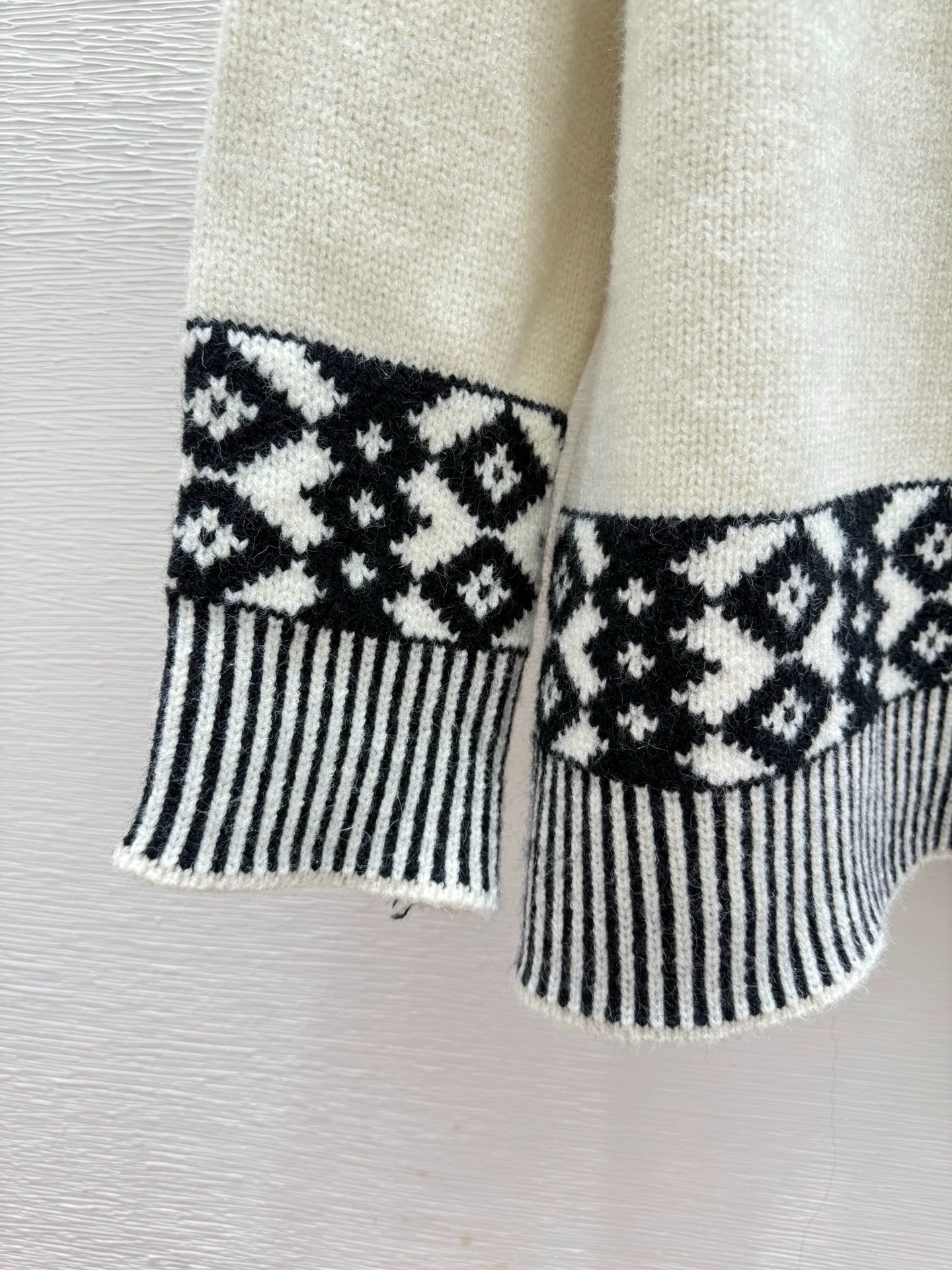 Black and white contrasting diamond patterned sweater