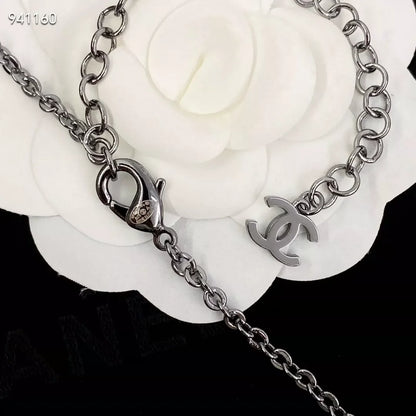 Pink enamel bow pearl sweater chain