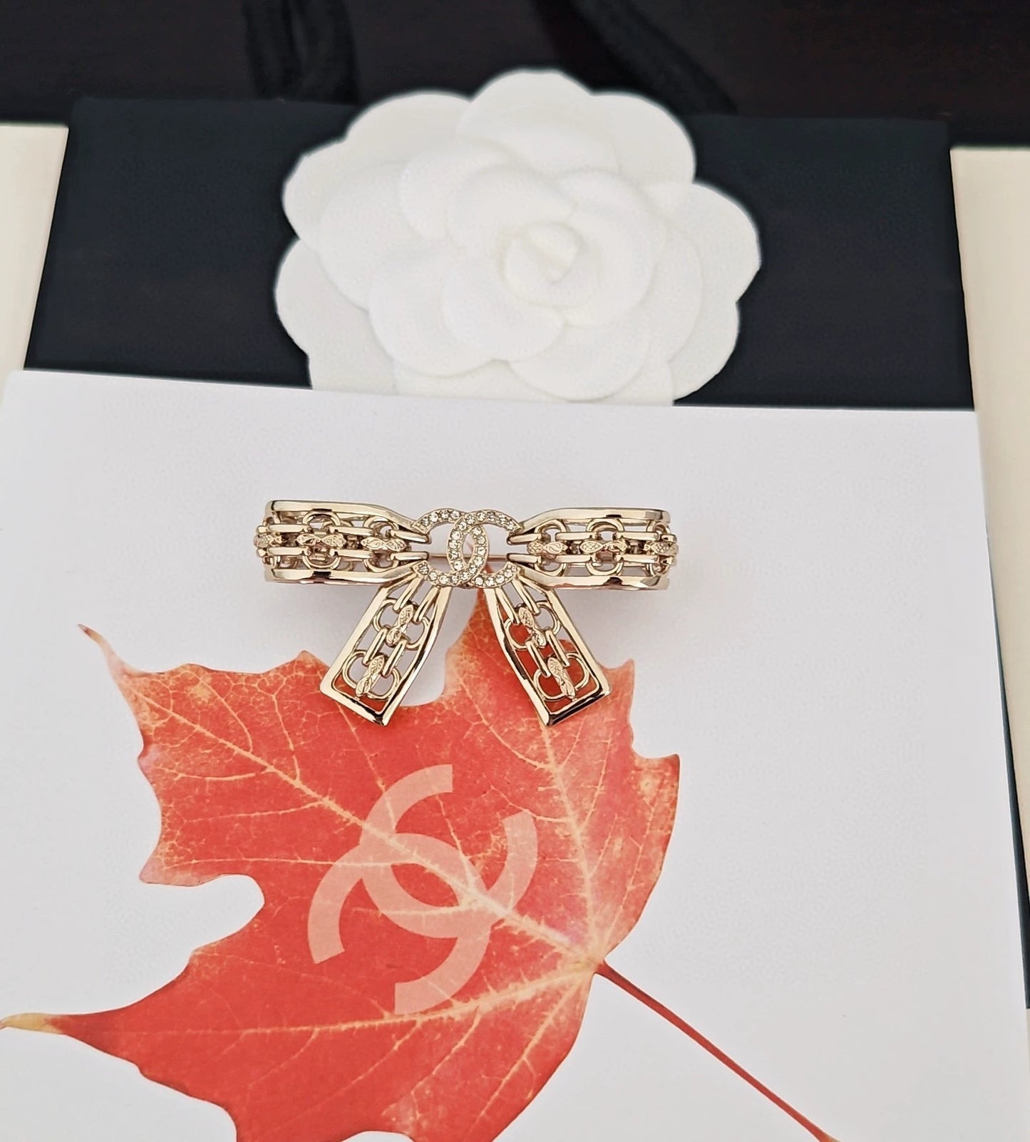 Light gold hollow bow brooch