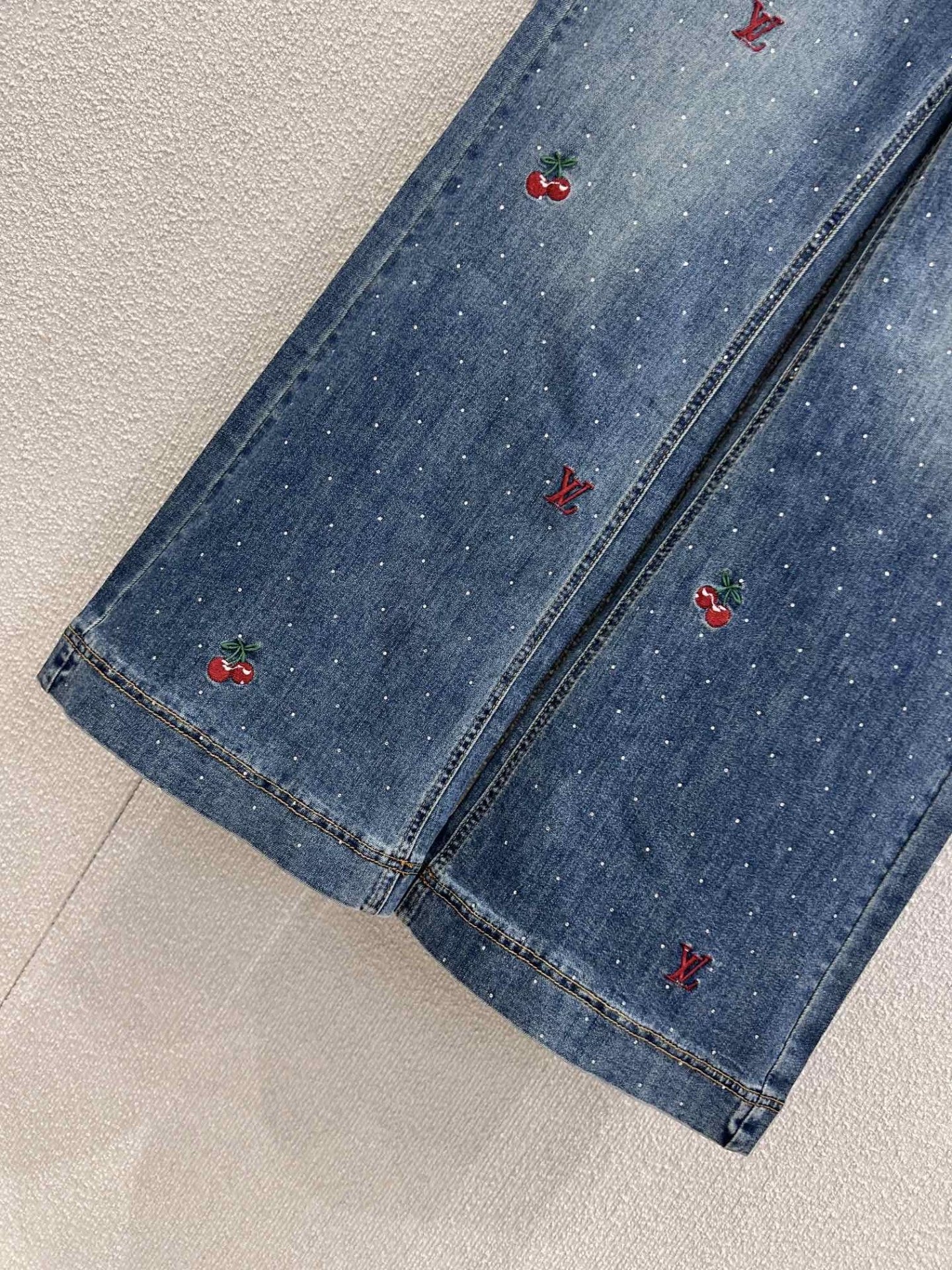25FW rhinestone logo embroidered denim pants