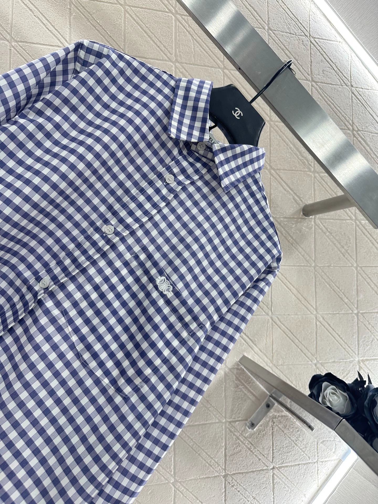 Short blue and white checkered shirt