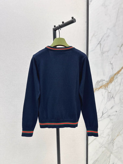 25 Knitted cardigan with woven pattern and V-neck