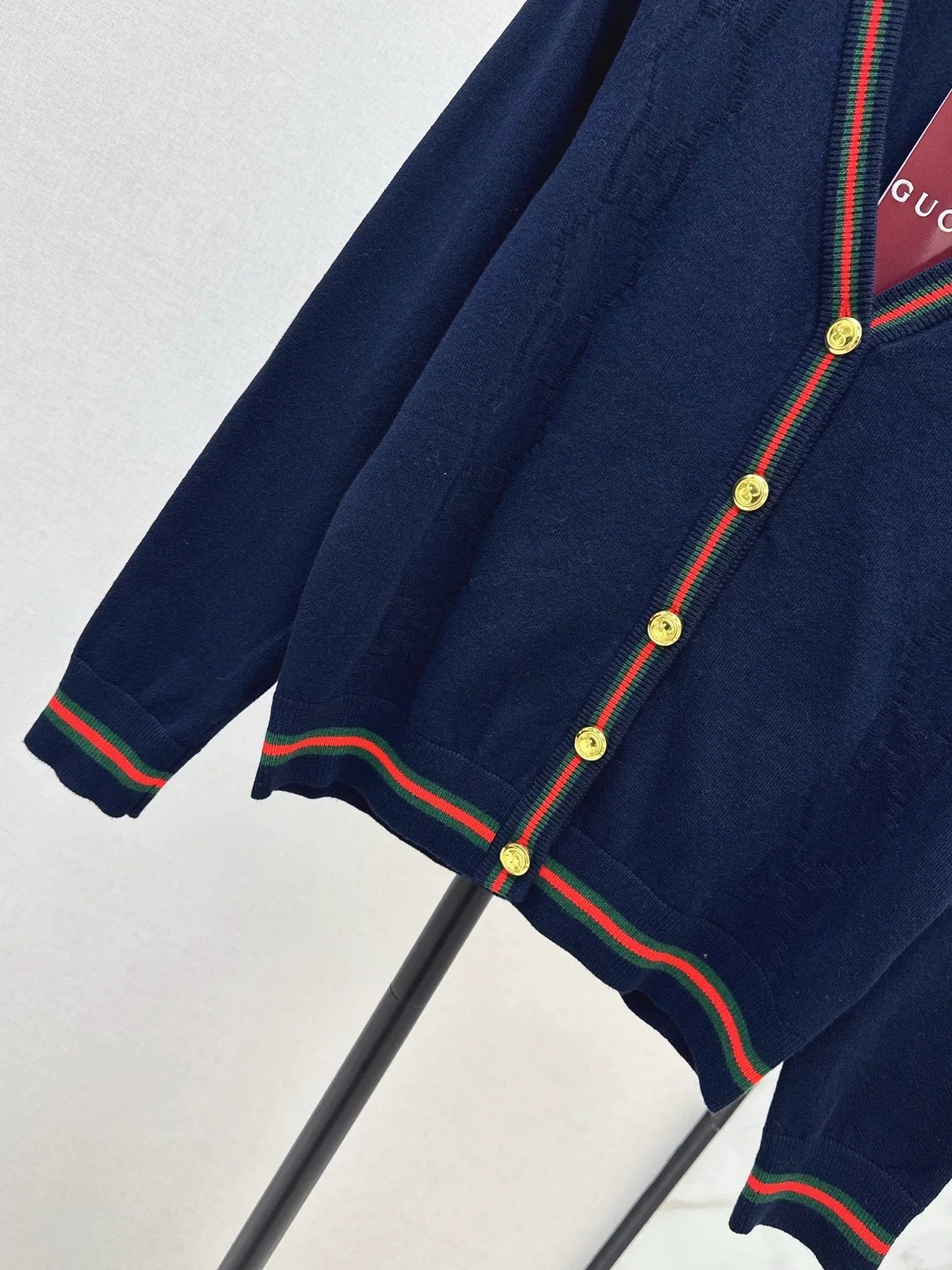 25 Knitted cardigan with woven pattern and V-neck