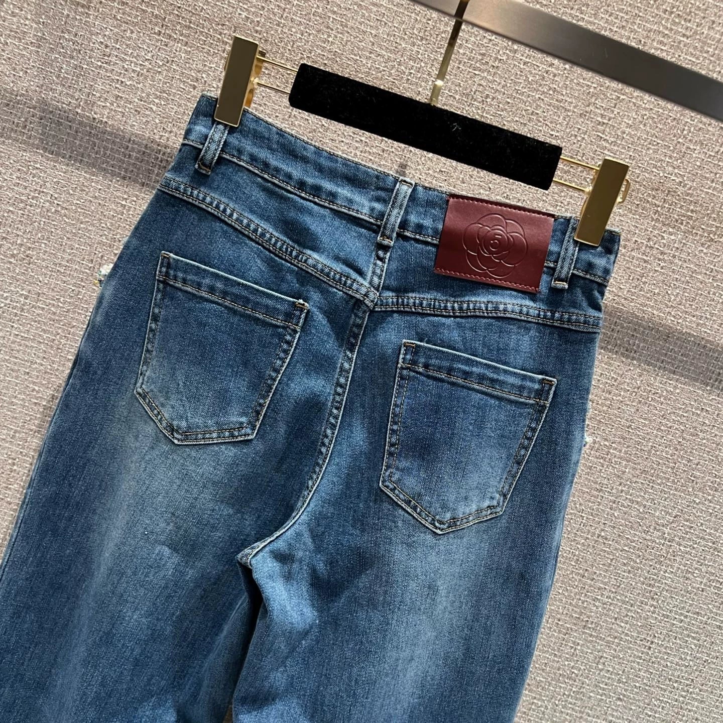 Pearl and rhinestone embellished wide-leg jeans