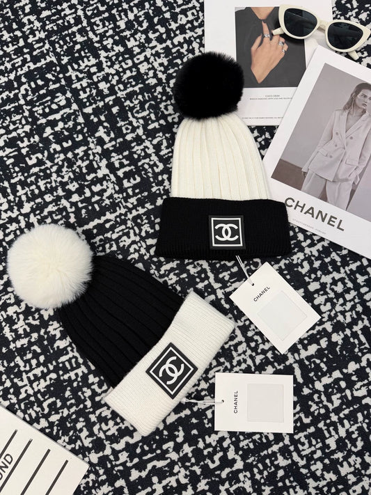 Black and white contrasting ball knitted hat