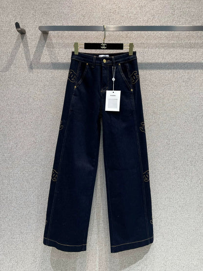 Side-embroidered washed denim jeans