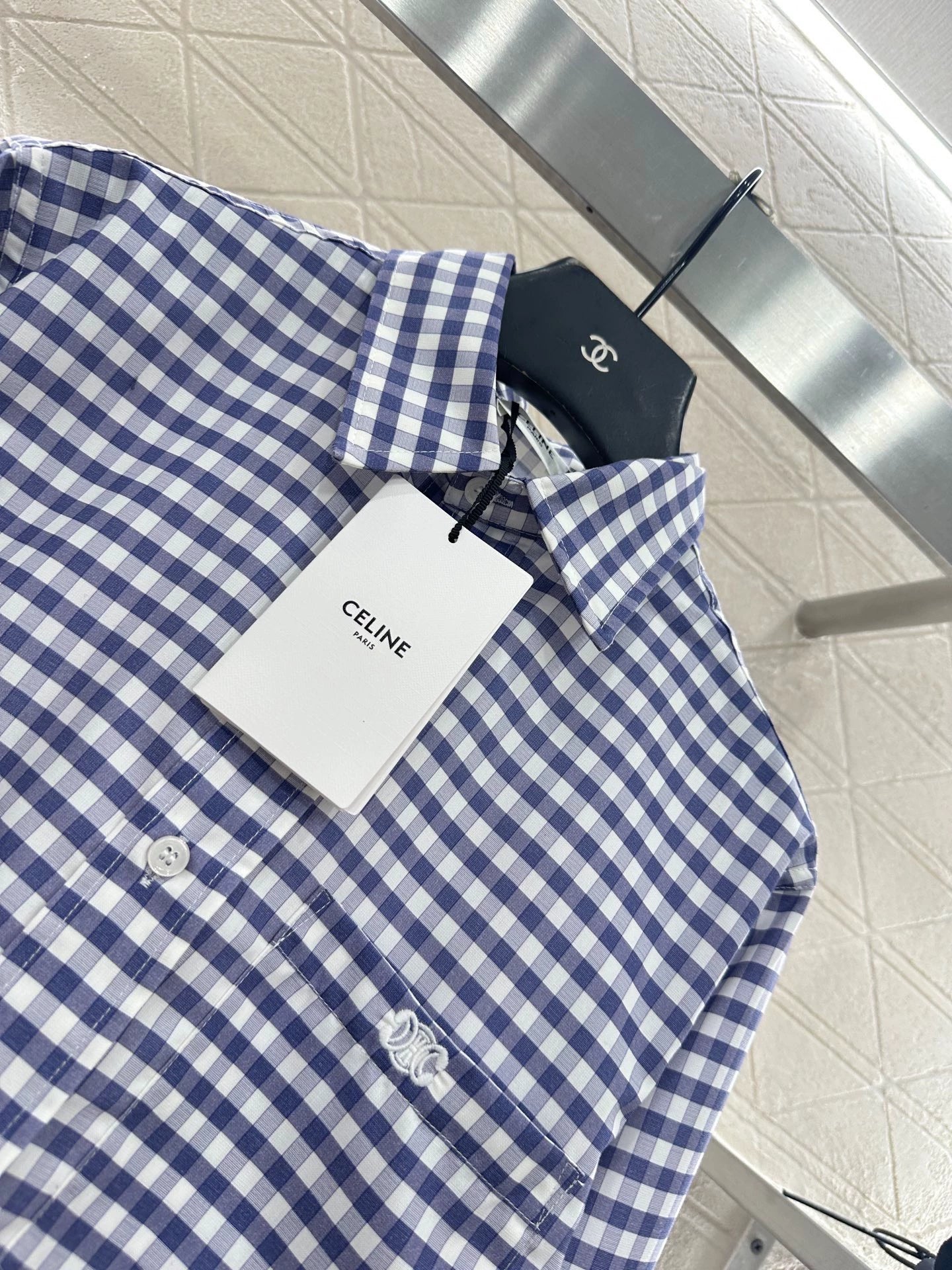 Short blue and white checkered shirt