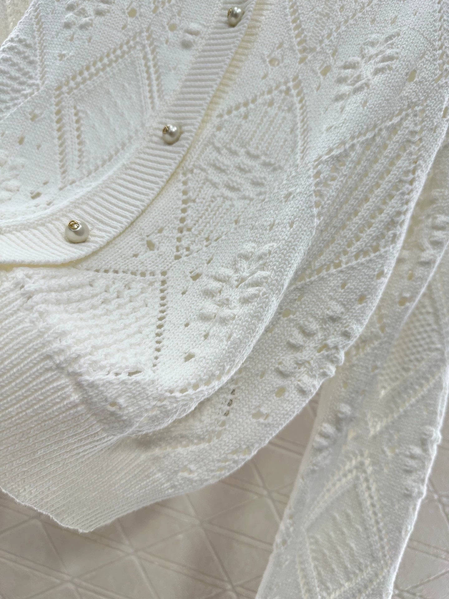 Hollow jacquard knitted cardigan