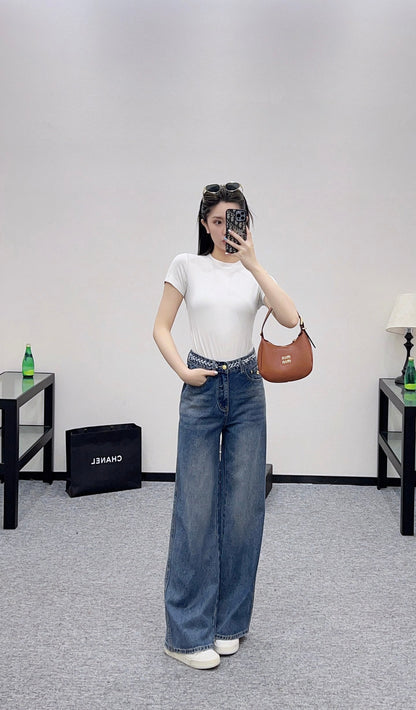 25 High-waisted bleached pleated denim trousers