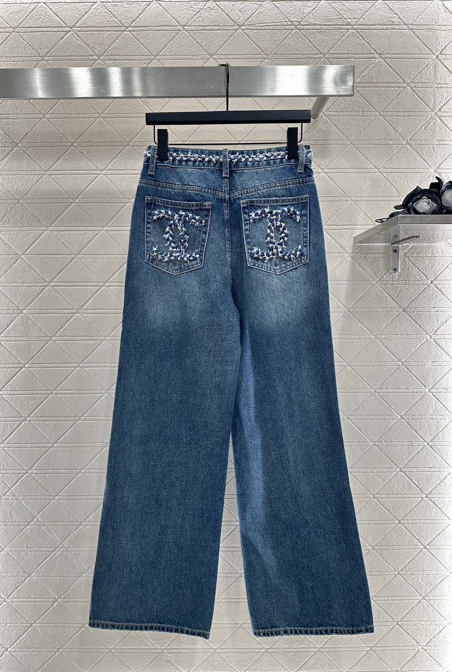 25 High-waisted bleached pleated denim trousers