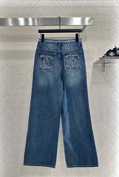 25 High-waisted bleached pleated denim trousers