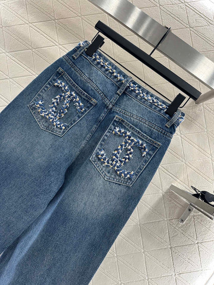 25 High-waisted bleached pleated denim trousers