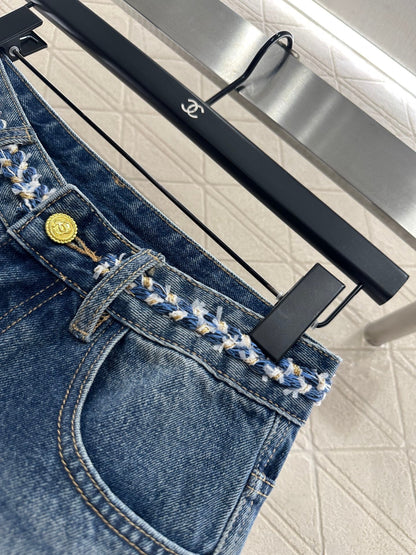 25 High-waisted bleached pleated denim trousers