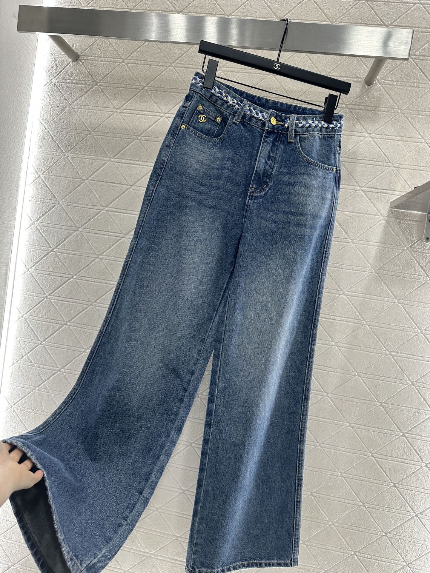 25 High-waisted bleached pleated denim trousers