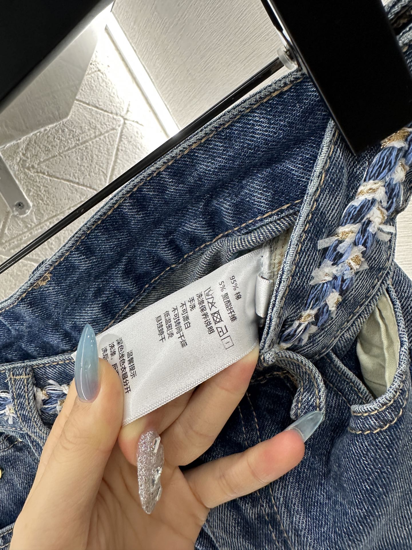 25 High-waisted bleached pleated denim trousers