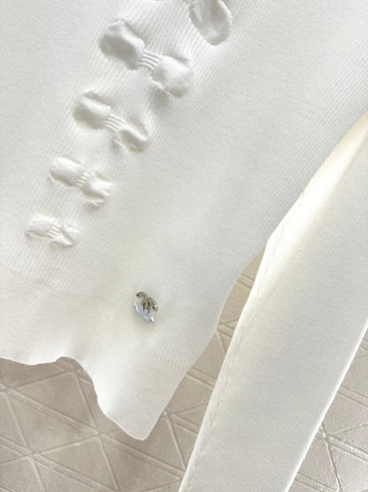 25 Bow tie high neck long sleeved sweater