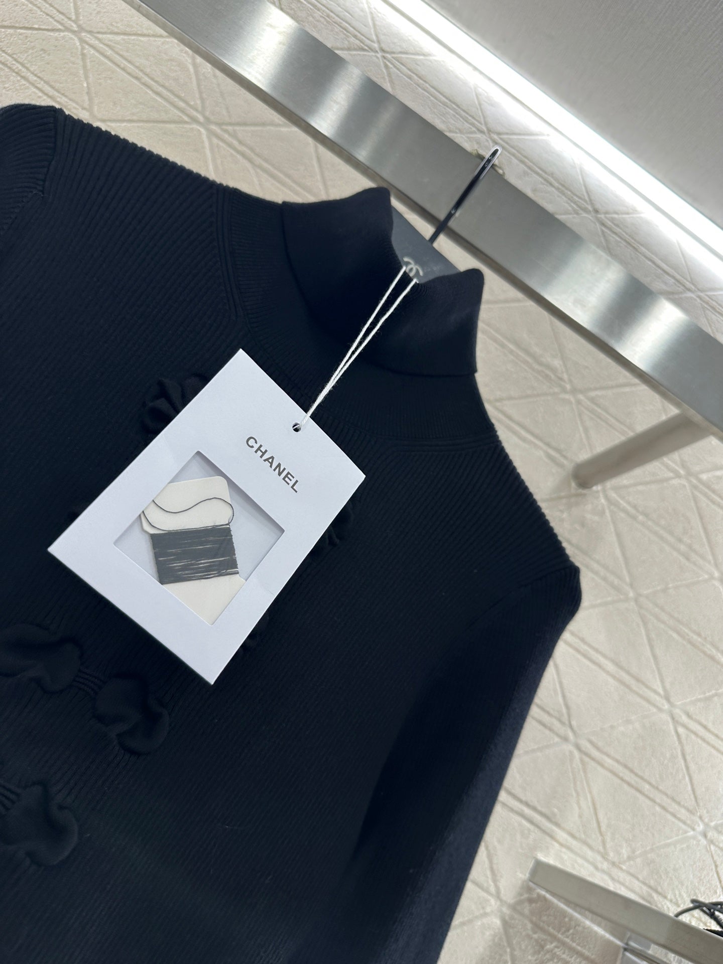 25 Bow tie high neck long sleeved sweater