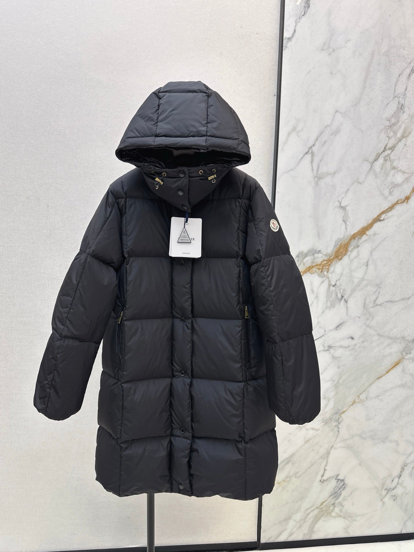 mid-length down jacket with hood and sleeve badge