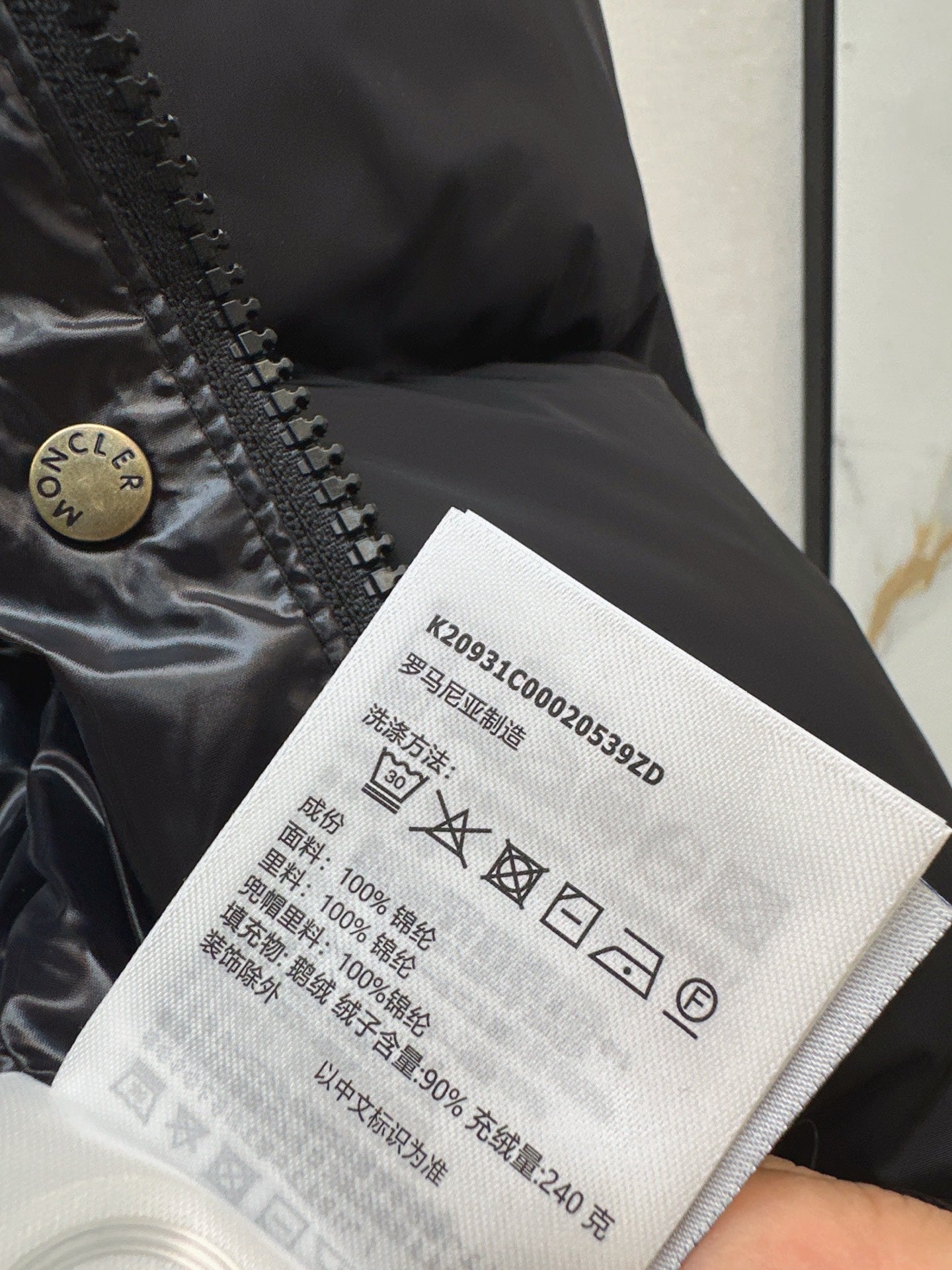 mid-length down jacket with hood and sleeve badge