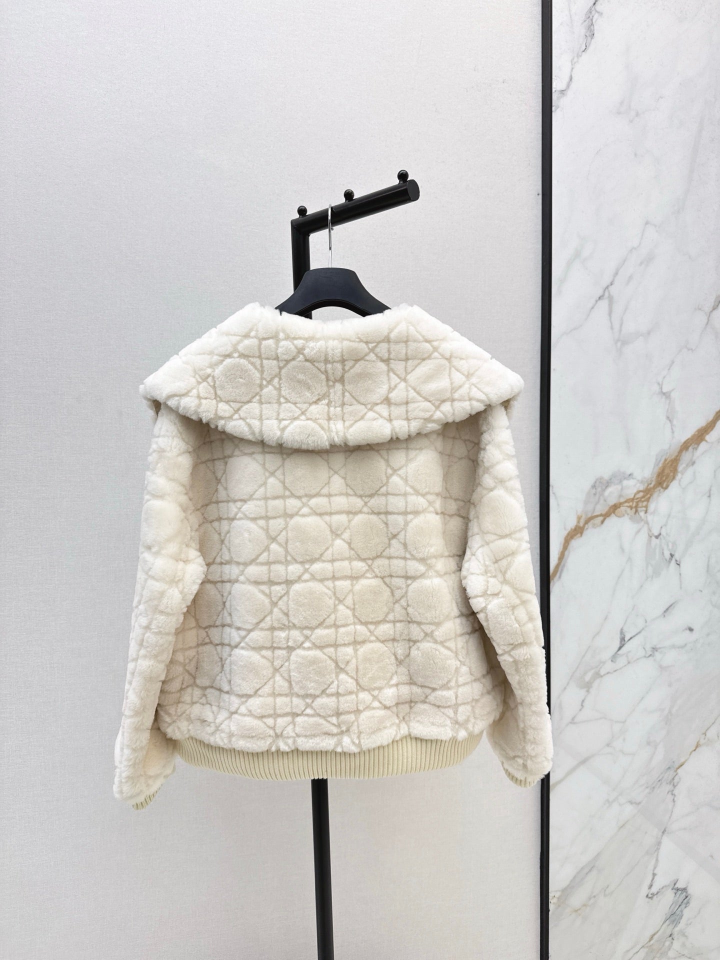 Check fur coat with large lapels