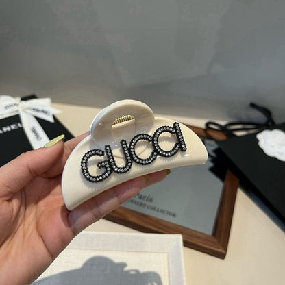 Diamond logo hair clip