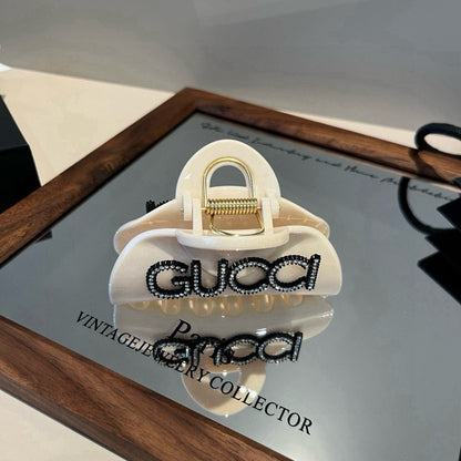 Diamond logo hair clip