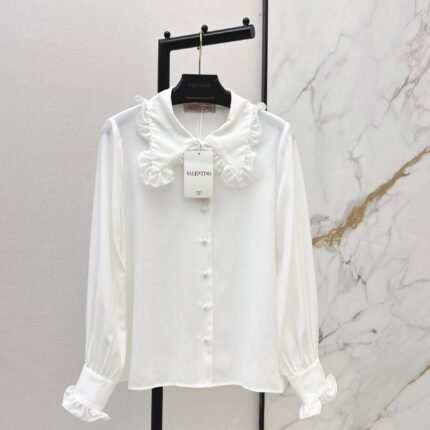 Ruffled trim silk shirt.